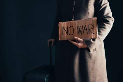 Vulnerable refugee. Ukraine protest banner. No war. Peace hope.